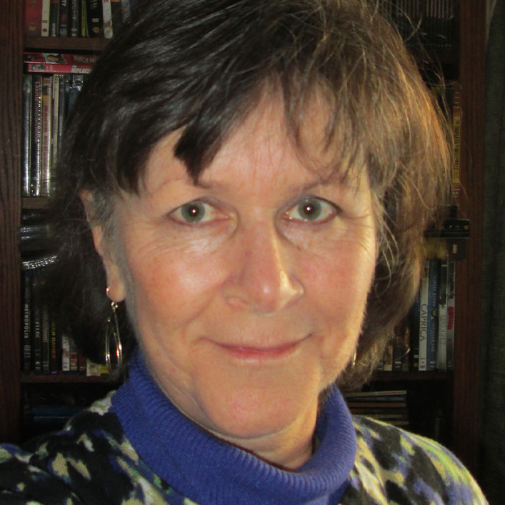 Headshot of Helen McCusker smiling confidently at the camera