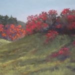 Plein air painting of vivid red sumac over grassy green hills
